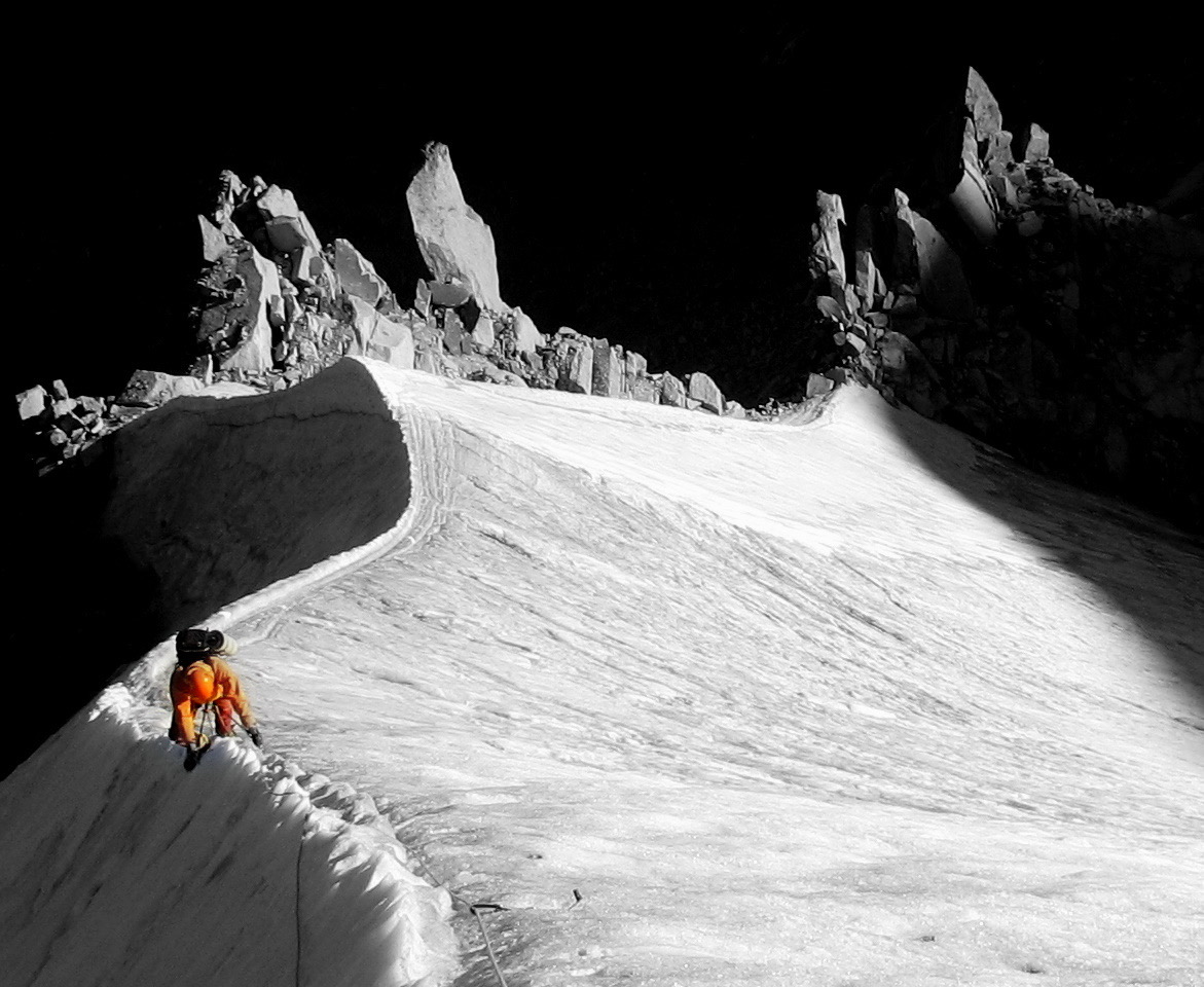 Mountaineering on a snow ridge in the Alps